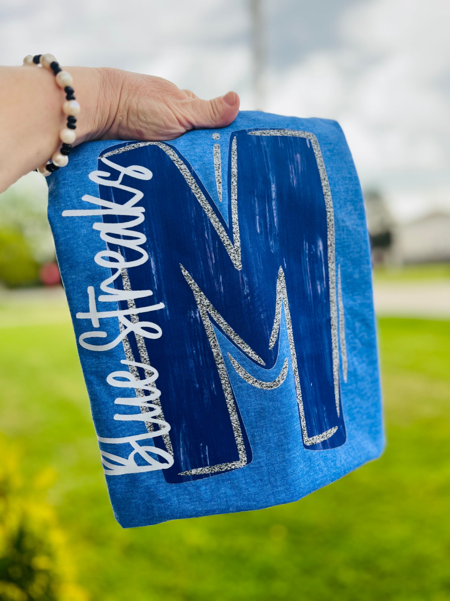 Painted letter mascot