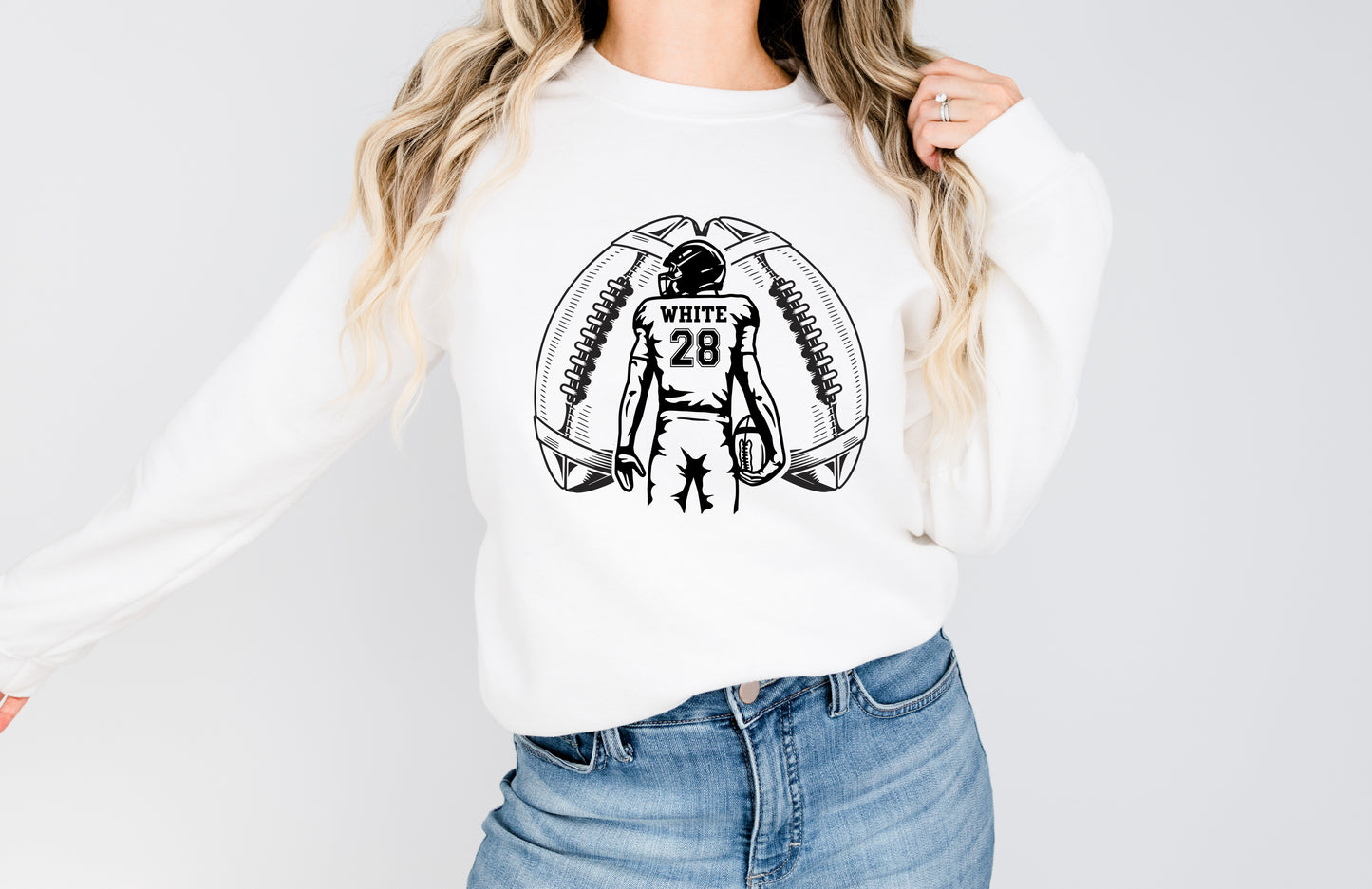 Football player between footballs