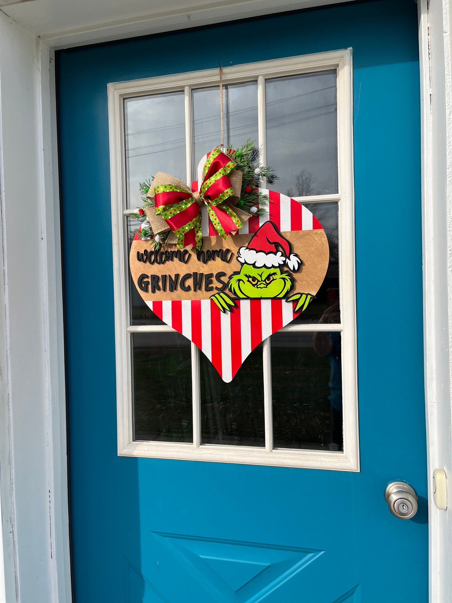 Green guy welcome home door hanger