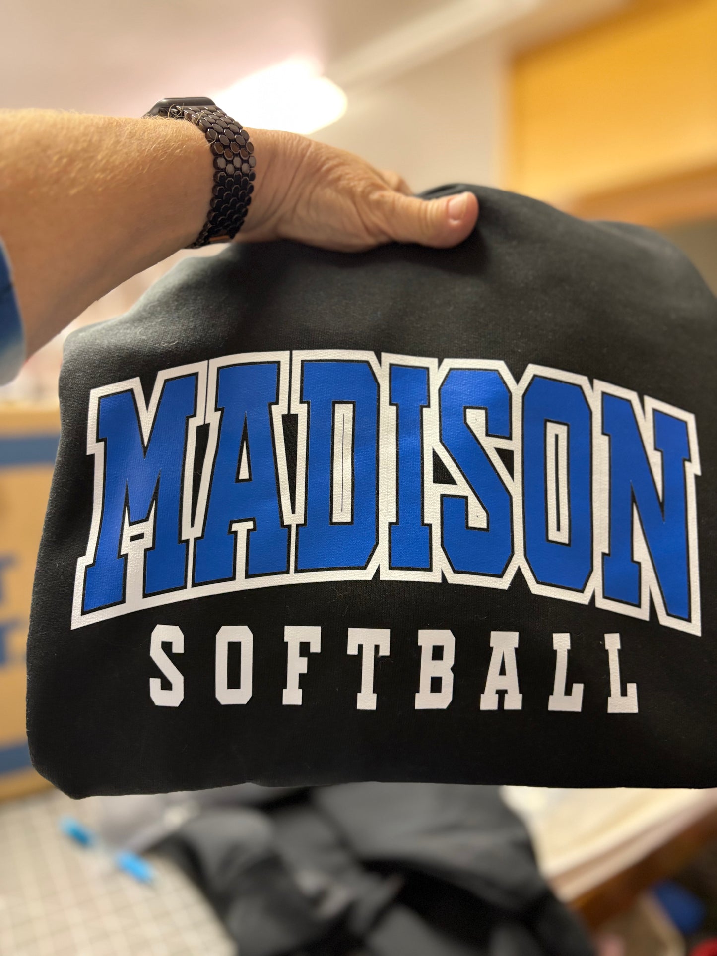 Arched school name with softball