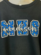Leopard school print with mascot name on sleeve